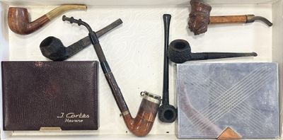 many different types of smoking pipes in a box