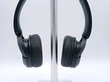 a pair of headphones on a stand on a white background