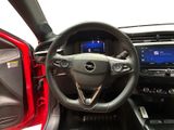 the interior of a car with a steering wheel and dashboard controls