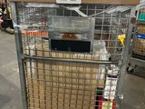 a metal cart with boxes in it in a warehouse