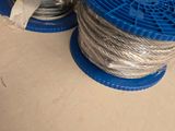 two spools of wires sitting on a table
