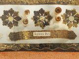 a picture of a gold and silver display case with flowers