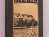 un vieux livre dont la couverture représente un homme en train de pêcher