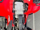 an overhead view of a red truck with its hood open
