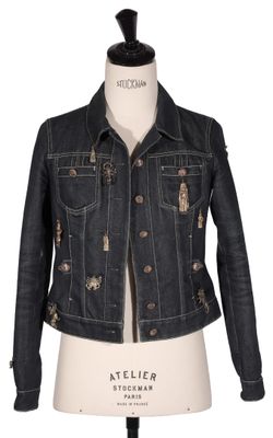the jacket is made of denim and has buttons on the front