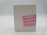 a white box with a pink sticker on it
