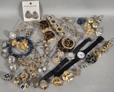 a lot of jewelry that is laying out on the table