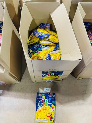several boxes of food are stacked on the floor in a store
