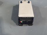 a small toy bus that is sitting on a table