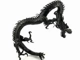a black dragon statue on a white background