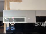 a picture of a black and white kitchen with a black counter top