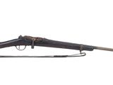 an old rifle with a wooden barrel and a wooden handle
