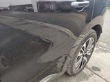 a close up of a car ' s paint job on the side of the road