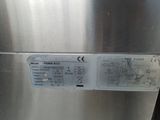 an image of a stainless steel refrigerator with a label on it