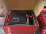 a box with a battery in it and a box with a charger inside of it