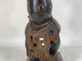 an image of a wooden sculpture of a rabbit on a wooden base