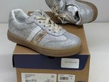 the shoes are on top of a box on a white surface