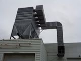 a large metal structure on the roof of a building