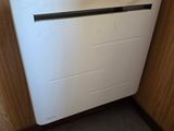 a white radiator in the corner of a kitchen