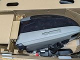 a box that has a computer in it on a table