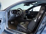 the interior of a car with the door open and the driver ' s seat up
