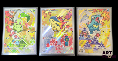 Trois cartes à collectionner Pokémon sont représentées sur un fond noir