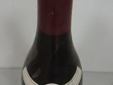 a bottle of wine that is sitting on a table