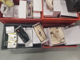 many boxes of shoes that are sitting on the floor