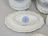 many plates and bowls that are sitting on a table