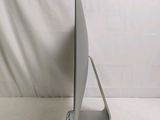a laptop computer sitting on a stand on a white surface