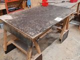 a workbench in a garage with tools on it