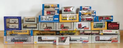 many different types of toy trains on display in the room