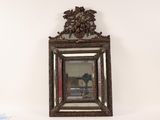 a mirror hanging on the wall above a table