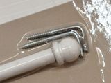 a screw and screwdriver in a package on a table