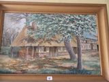 une photo d'un tableau représentant une maison au toit de chaume accrochée au mur