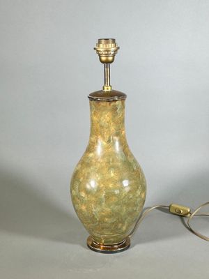 a lamp that is sitting on a table next to a lamp