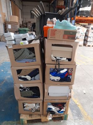 many boxes of shoes stacked on top of each other