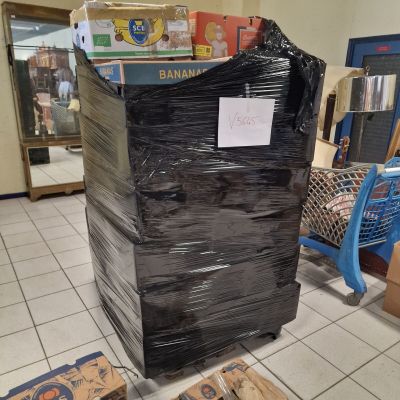 a large stack of boxes in the middle of the floor