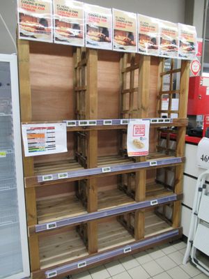 a lot of shelves that have food on them in a store