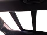 a view of the inside of a car from the driver ' s seat