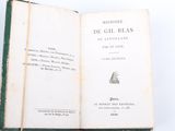 an open book with a picture of a ship on the cover