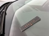 a sticker on the windshield of a car that says virtuto