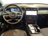 the interior of a car with a steering wheel, dashboard, and dashboard controls