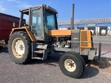 a tractor that is parked on the side of the road