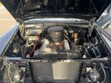 a black car with a radiator and a radiator on the hood