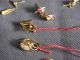 many different types of earrings that are on the table