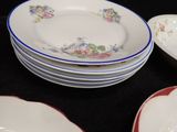 a lot of plates that are sitting on a table