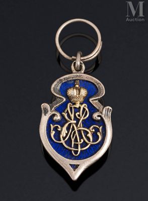 a close up of a silver and blue medal on a black surface