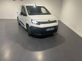 the white van is parked in the empty room of the building