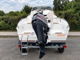 a boat that is parked on the side of the road